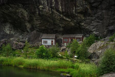 Small white, fishing house norway rock.の写真素材