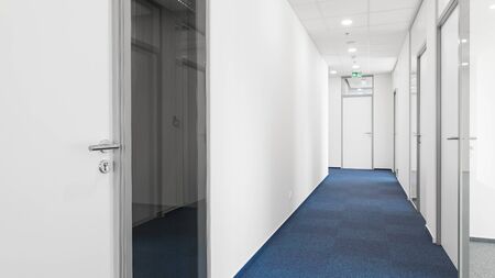 empty corridor for offices with white wallsの写真素材