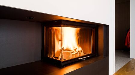 modern fireplace in the living room with space for storing woodの写真素材