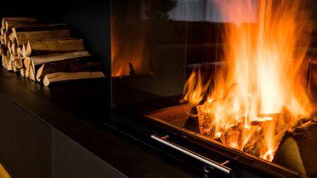 modern fireplace in the living room with space for storing woodの写真素材