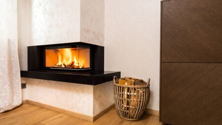 modern, minimalist fireplace in simple lines and wood place storageの写真素材