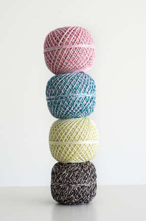 Colorful wool balls against bright white background, isolatedの写真素材