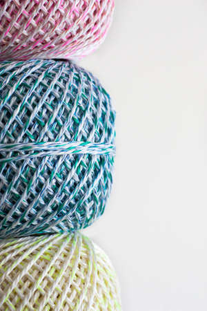 Colorful wool balls against bright white background, isolatedの写真素材