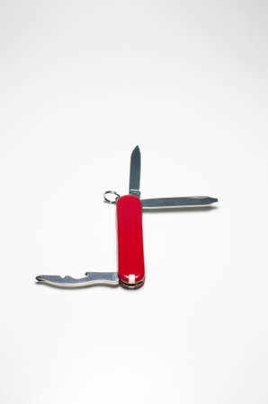 Small Swiss army knife close up isolated against white backdropの写真素材