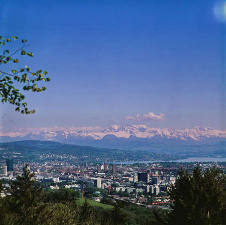 Zurich city scape with the swiss alps in the background in the summerの写真素材