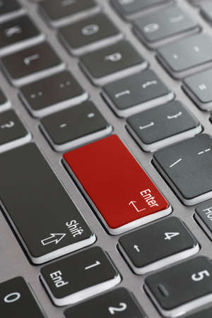 Laptop keyboard macro close up fading enter shift key focused red enter keyの写真素材