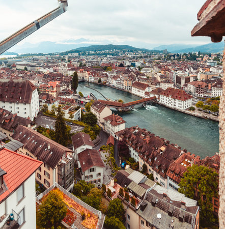 Aerial view of the city of Lucern Switzerland on an overcast day mountains in the background