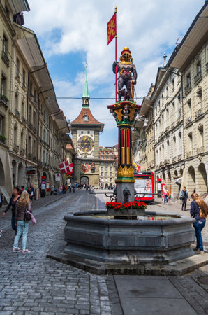 Bern City Switzerland  street water fountain statue low angle view point sunny overcast day tourist walkingのeditorial素材