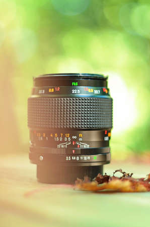 Old metal macro prime photography lens close up isolated against green backdrop 2019の写真素材