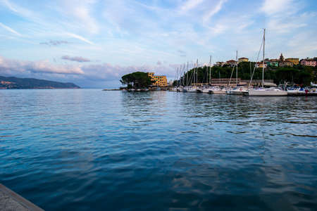 Small port on the mediterranean sea in an Italian village with docked sail boats on a sunny summer day 2019の写真素材