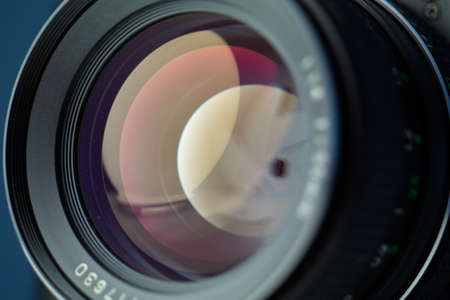 Vintage lens front element close up macro shot with light reflections and visible closed  aperture blades 2019の写真素材