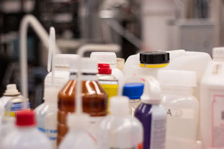 Various plastic bottle chemical containers in a science laboratory group shot shallow depth of field 2020の写真素材