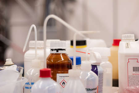 Various plastic bottle chemical containers in a science laboratory group shot shallow depth of field 2020の写真素材