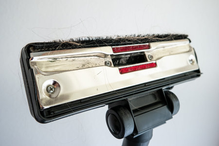 Vacuum cleaner base plate brush full of hairs and carper dirt close up shot 2020の写真素材