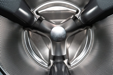 Inside shot of empty silver washing machine drum wide angle view 2020