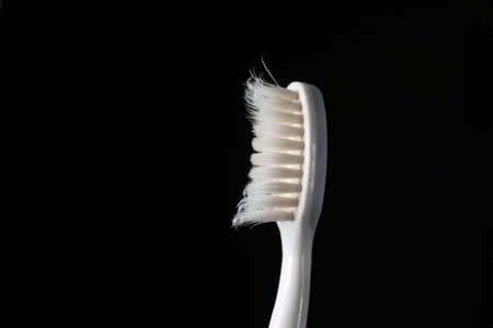 Well used toothbrush head close up macro shot isolated on black 2020の写真素材