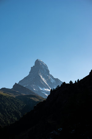 Matterhorn mountain peak as seen from Zermatt resort town mid day summer time sunny telephoto shot