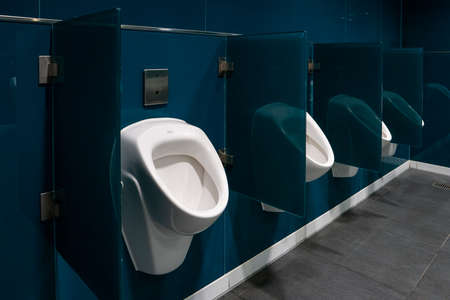 Empty men's public toilet room inside international airport terminal 2020の写真素材