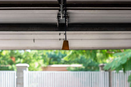Manual cable operated garage shutter door opener inside to out view point.の写真素材
