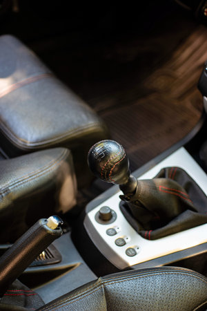 Car manual gear box housing and leaver inside vehicle top view generic.