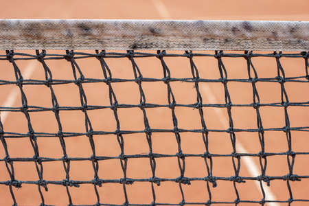 Tennis court string mesh net close up front view.の写真素材
