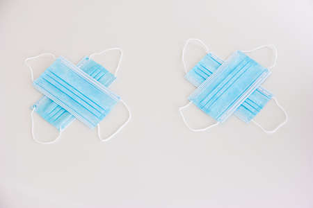 New blue textile medical face masks isolated on white arranged in emoji concept no people to view.の写真素材