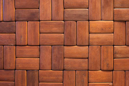 Brown wooden rectangular laminated tiles texture close up shot top view.の写真素材