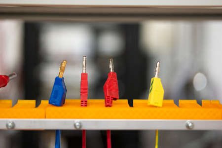 Small electrical connectors in a science lab. Close up front view, shallow depth of field, no people.の写真素材