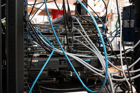 Many cables connecting various electronic devices inside science lab. Close up shot, no people.の写真素材