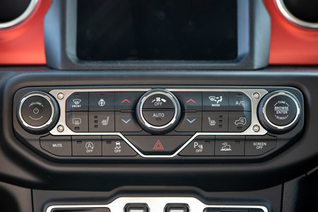 New car generic dashboard layout with ac hvac control buttons. Close up front view, no people.の写真素材
