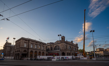03-08-2023  Zurich city Switzerland. Part of the facade of the main train station or Hauptbahnhof. Partially covered by renovation works.のeditorial素材