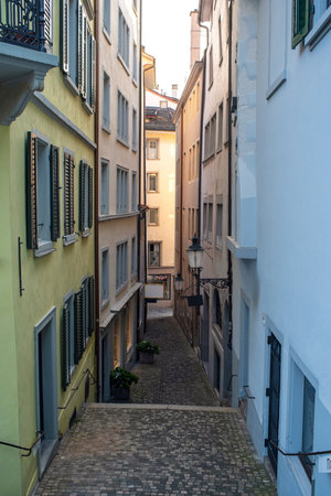 Narrow street alley and old architecture in a European city, no people.の写真素材