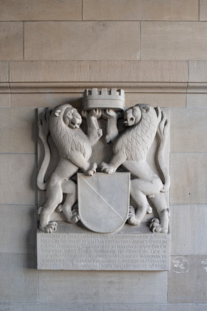 28-08-2024 Zurich, Switzerland. City coat of arms, or the arms of Zurich. Stone carved city symbol at Wasserkirche downtownのeditorial素材