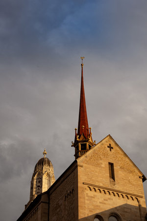 03-09-2024 Zurich, Switzerland. Low angle view of the bell towers of Grossmunster church on an early summer morning, no people.のeditorial素材