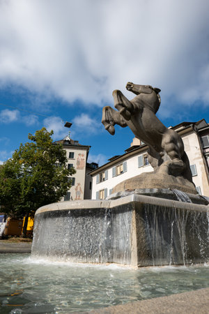 06-09-2024 Zurich, Switzerland. Manessebrunnen or Manesse drinking water fountain at Hirschengraben 7, 8001 ZÃ¼rich. Sunny summer day, looking up, wide angle shot, no people.のeditorial素材