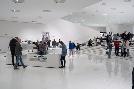 14-09-2024, Stuttgart, Germany. Porsche museum exhibition hall. Visitors walking around the exhibition halls looking at the cars.のeditorial素材