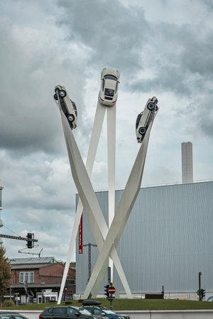 14-09-2024, Stuttgart, Germany. Tall car sculpture of 3 Porsche 911 cars outside the Porsche museum. Cloudy summer day, no people.のeditorial素材