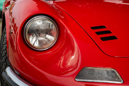 Vintage car headlight or headlamp unit. Close up shot, shallow depth of field, no people.
