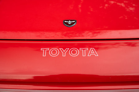 6-10-2024 Zurich, Switzerland. 1990s red W10 Toyota MR2 bonnet or hood top down shot. Badge and old type lettering of brand name, no people.のeditorial素材