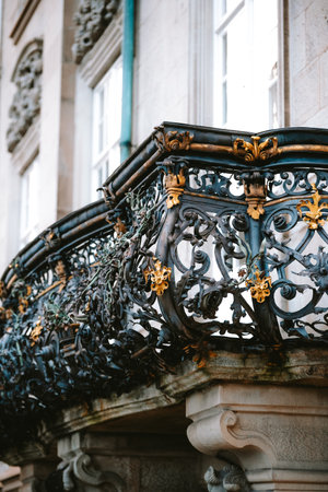 Elegant, decorative old wrought iron balcony. Close up detail shot, looking up view, no people.の写真素材