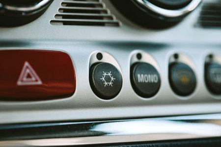 Car AC or air conditioning dashboard button and snowflake symbol. Close up shot, no people.