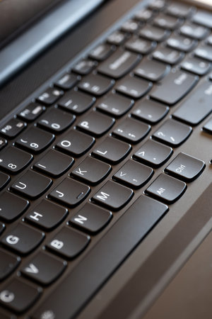 Laptop or notebook black keyboard. Close up shot, shallow depth of field, no people.の写真素材