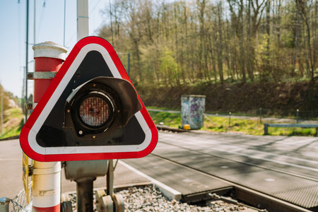 Railroad crossroad traffic signal or stop sign. Close up shot, shallow depth of field, rural background, no people.の写真素材
