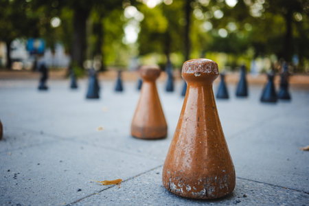 Large, wooden peon chess piece as part of a public park giant chess board. Close up shot, shallow depth of field, no peopleの写真素材