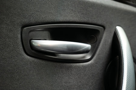 Gray, metal, interior car door handle. Close up detail shot, no peopleの写真素材