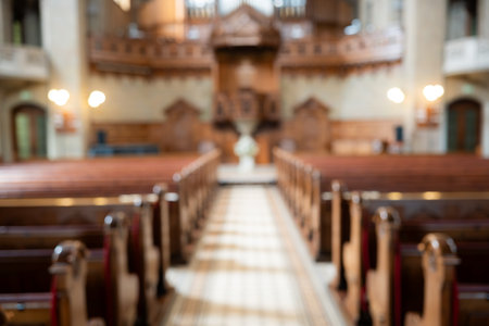 Blurred image of empty pews and altar inside protestant church in Europe. Wide angle view, natural window light, no peopleの写真素材