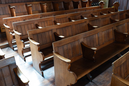Empty church pews inside protestant church in Europe. Wide angle view, natural window light, no peopleの写真素材