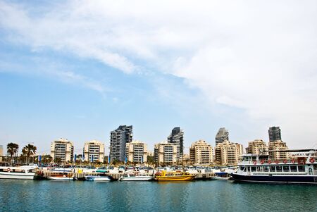 A view from the sea on a wharf with some little pleasure boatの写真素材