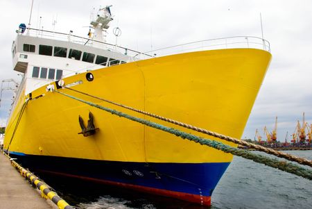 A big yellow oceanic ship by the wharfの写真素材