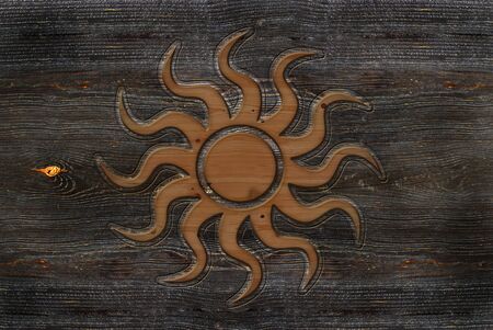 An illustration of a wood-carving Sun signの写真素材